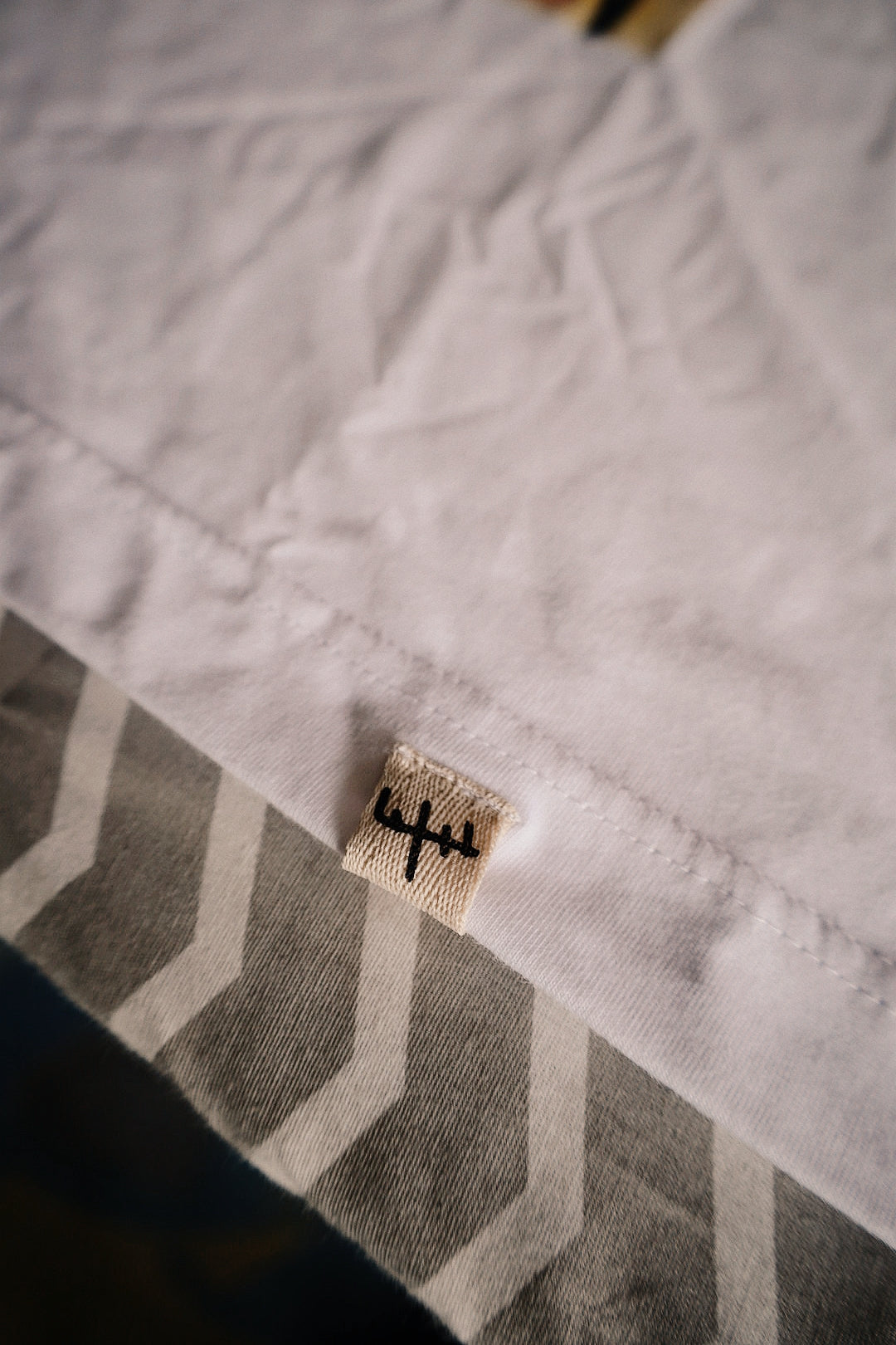 “Folded ‘Energy in Motion’ box fit t-shirt by Samurai Farai on black background”